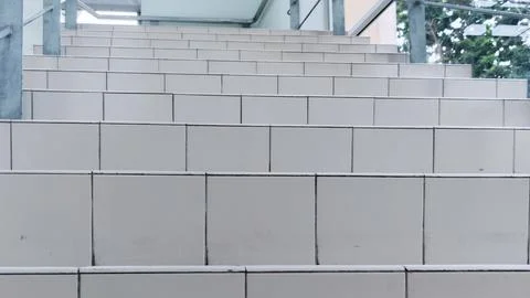 "Low-Angle View of Ascending White Tiled Steps, Creating a Clean and Minima.. Stock Photos