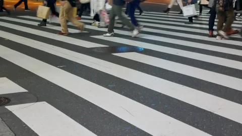 Low angle view to the asphalt street at zebra crossing area at intersection.. 動画素材 259605146
