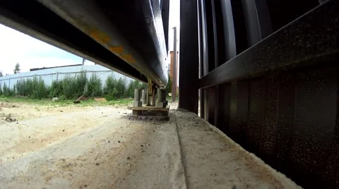 Low angle view automatic door opening, iron gates mechanism bottom view Stock Footage 64918612