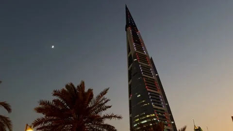 Low angle view of Bahrain World Trade Center skyscraper with crescent moon Stock Footage 342976708