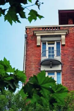 Low angle view of a balcony on a red brick building Stock Photos