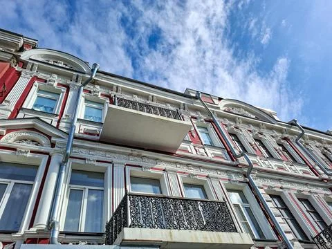 Low angle view of Baroque architecture showcasing white stuccowork and red .. Stock Photos