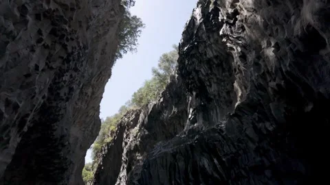 Low angle view of basalt rock walls in Alcantara Gorges, Sicily Stock Footage 346146265