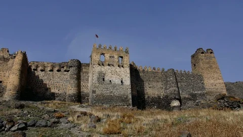 Low angle view of the bastion, moat and main outer wall at the front of a large Stock Footage 82688227