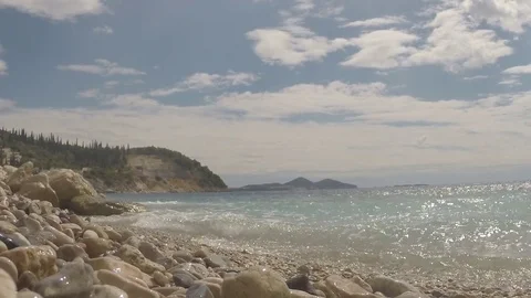 Low angle view of a beach and waves crushing the shore Stock Footage 71532795