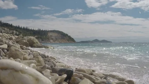 Low angle view of a beach and waves crushing the shore Video stock 71532864