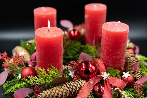 Low angle view of beautiful advent wreath with one burning candle. Stock Photos