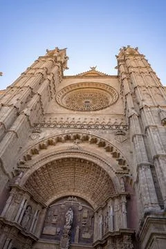 Low angle view of beautiful La Seu cathedral against clear blue sky Stock Photos