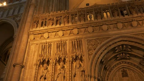 LOW ANGLE VIEW: Beautifully crafted stone quire screen with statues of kings Stock Footage 258976461