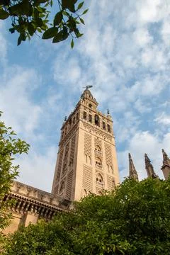 Low angle view of bell tower over Seville cityscape, Andalusia, Spain Stock Photos