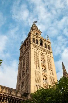 Low angle view of bell tower over Seville cityscape, Andalusia, Spain Stock Photos