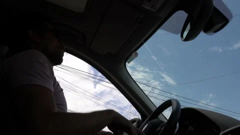 Low angle view from below of the passenger seat of a man dancing gesturing with Stock Footage 197079402