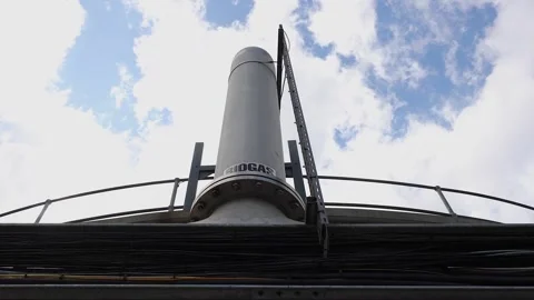 Low angle view of biogas flare stack at commercial bio gas production Stock Footage 342807617