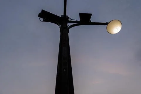 Low angle view of black lamppost under dark blue sky Foto stock