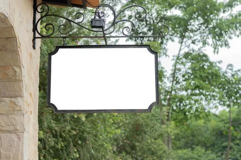 Low angle view on a blank sign mockup outside the building, banner hanging .. Stock Photos