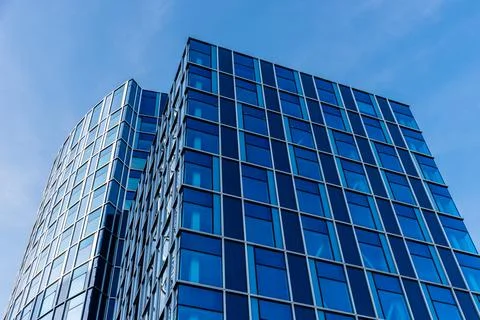 Low angle view of blue skyscraper against sky in Amsterdam Stock Photos
