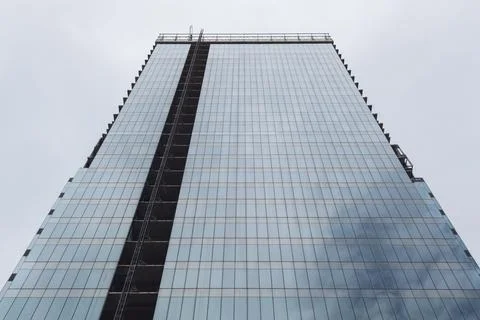 Low Angle view of a Blue window modern skyscraper under construction Stock-Fotos