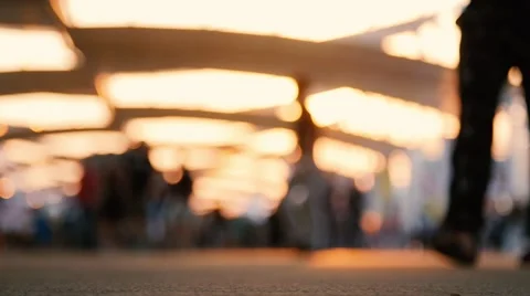 Low angle view of blurred people walking on the street. Shot in slow motion Vídeo Stock 53332813
