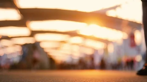 Low angle view of blurred people walking on the street. Shot in slow motion Stock Footage 53333146
