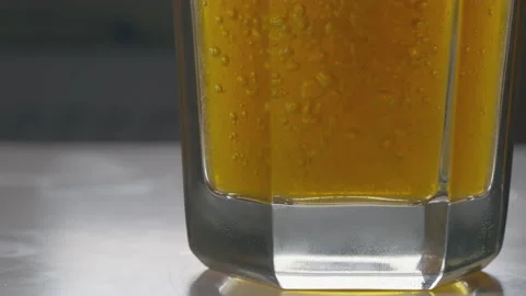 Low angle view of the bottom of a beer glass with lager Stock Footage 162863201
