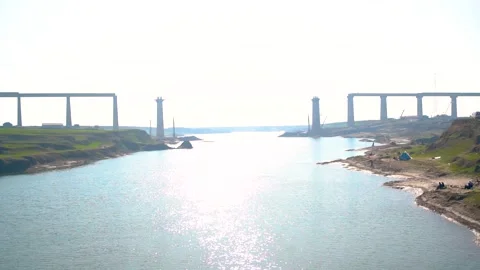 A low-angle view of a bridge under construction, with the sun shining bright Stock-Footage 301710453