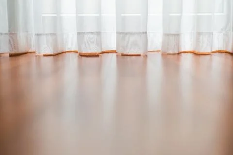 Low angle view of the brightly lit curtain  by the window Stock Photos