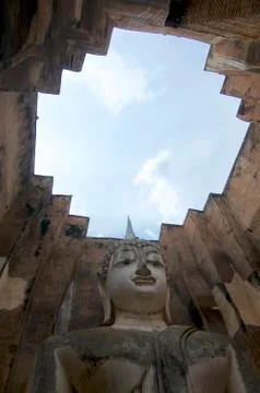 Low angle view of the Buddha statue of Wat Si Chum in Sukhothai Historical Pa Stock Photos