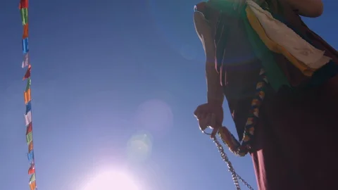 Low angle view of buddhist monk and incense burner at ceremony. 스톡 동영상 127935239