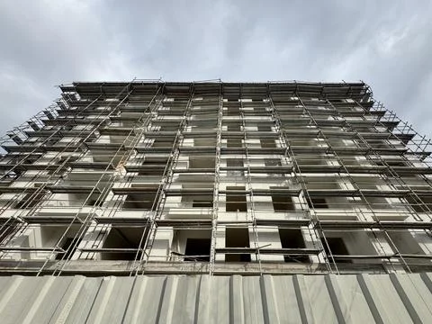 Low angle view of building covered in scaffolding Stock Photos