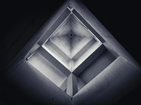 Low angle view of a building structure creating a geometric shape, monochromatic Stock Photos