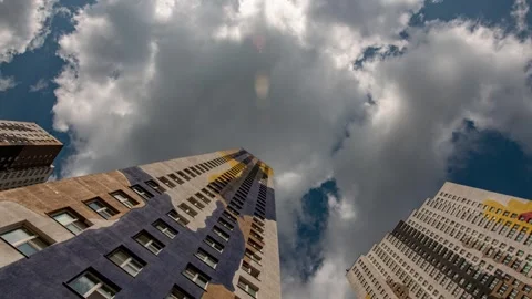 Low Angle View Of Buildings with Clouds In The Blue Sky 4k timelapse Stock-Footage 274901194