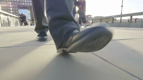 Low angle view of a business man's feet walking Video stock 99208528