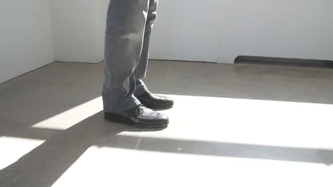 Low angle view of businessman walking through building in New York City with Stock Footage 83550700