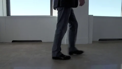 Low angle view of businessman walking through building in New York City with Stock Footage 83550720