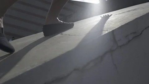 Low Angle View Of Camera Following Walking Feet Stock Footage 79459297