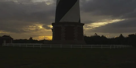 Low angle view of  Cape Hatteras lighthouse at sunrise, medium shot Stock Footage 103489103