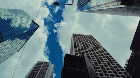 A low-angle view captures an awe-inspiring urban skyline in Hong Kong, dominated Stock Footage 338311513