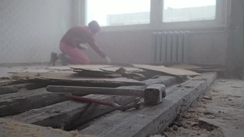 Low angle view captures exposed timber framework and manual cleanup Stock Footage 341844978