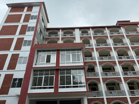 Low angle view captures the intricate facade of a multi story building featur Foto stock