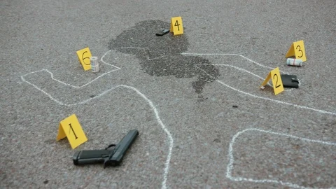 Low angle view of chalk outline of a dead body on the ground. Portrait of Video stock 112983467