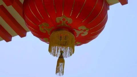 Low angle view of Chinese lanterns hanging in front of a building Stock Footage 120358090