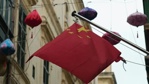 Low Angle View of Chinese National Flag with Traditional Red Lanterns Stock Footage 330864295