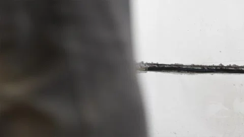 Low angle view of chiseled cable conduits and worker feet Stock Footage 339298329