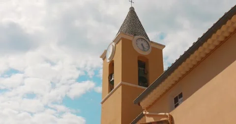 Low Angle View of Church Bell Tower with Clock in Sainte-Agnès, South of France Stock Footage 346047764
