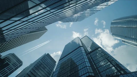 Low angle view of city skyline buildings with commercial aircraft. Stock Footage 157851633