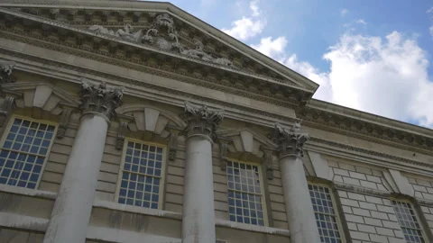A low angle view of a classical building with columns and sculptures. Stock Footage 287504444
