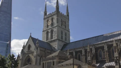 A low angle view of the clock tower of an old stone church. Stock Footage 107072838