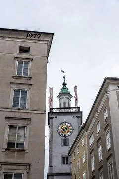Low angle view of clock tower in Salzburg Stock Photos