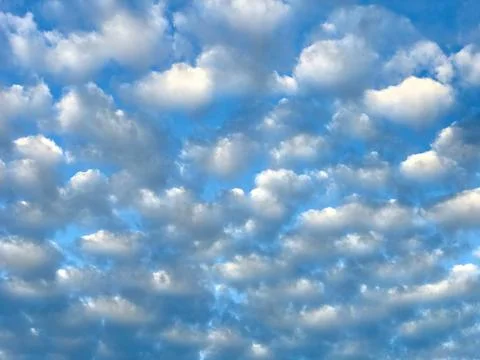 Low angle view of cloudy blue sky Stock Photos