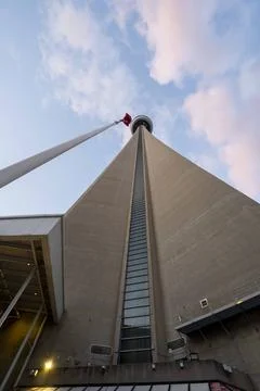 Low Angle View of CN Tower with Canadian Flag in Toronto 写真素材